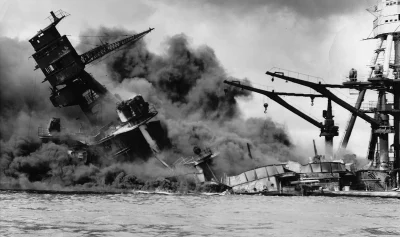 Ship sinking amid smoke at Pearl Harbor in black and white photo