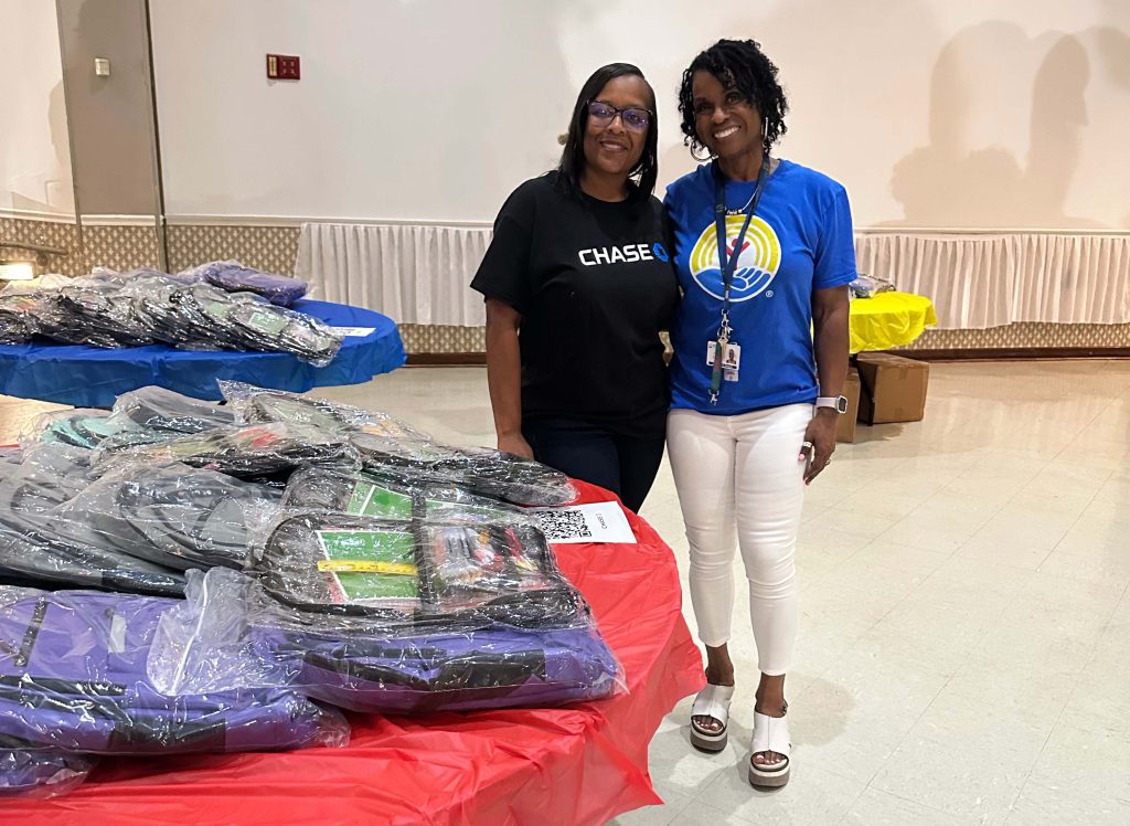 Gina Davis-Owens smiles with a Chase Bank representative at their joint back-to-school event in Fairfield.