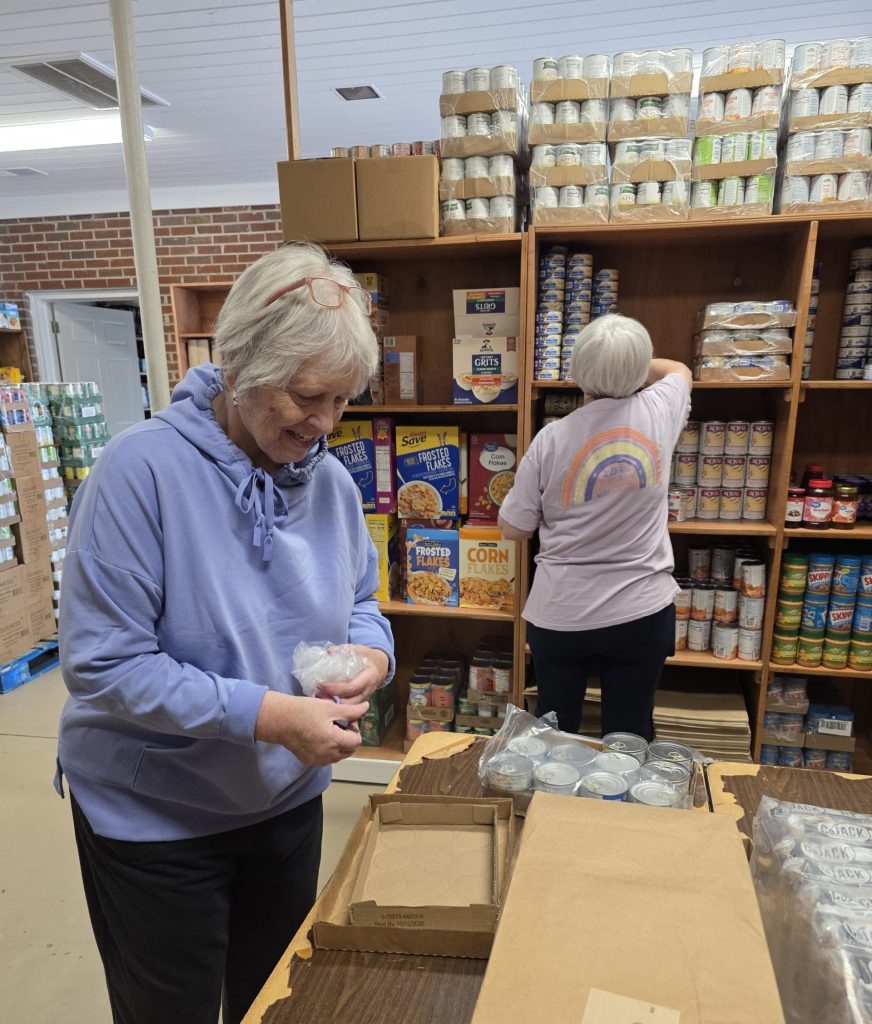 Shelby Emergency Assistance recently welcomed volunteers from the Community Food Bank to help stock its pantry.