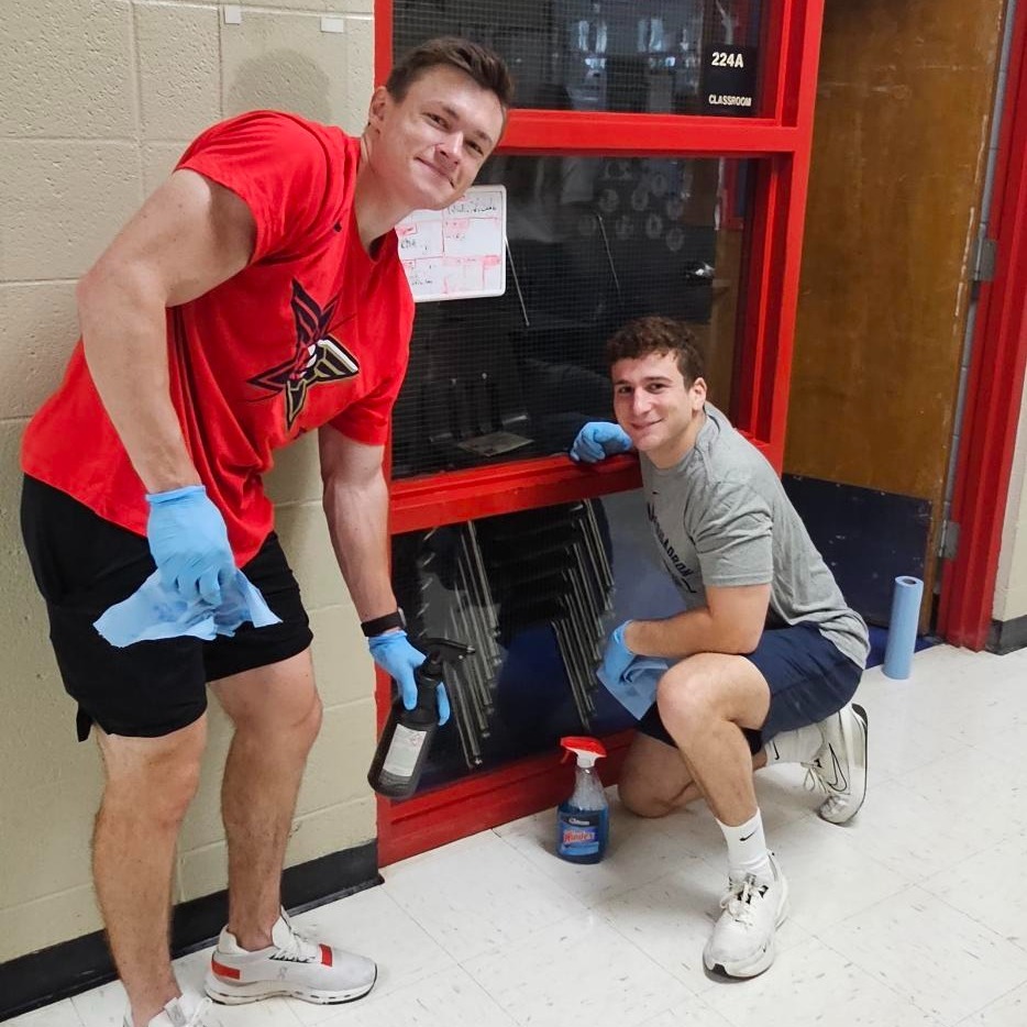 Volunteers from the Birmingham Squadron cleaning up Robinson primary as part of a back-to-school initiative. 