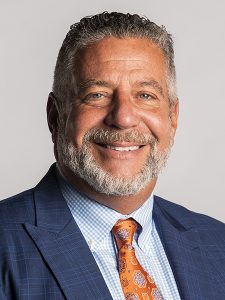 This image has an empty alt attribute; its file name is Bruce-Pearl-Headshot-225x300.jpg