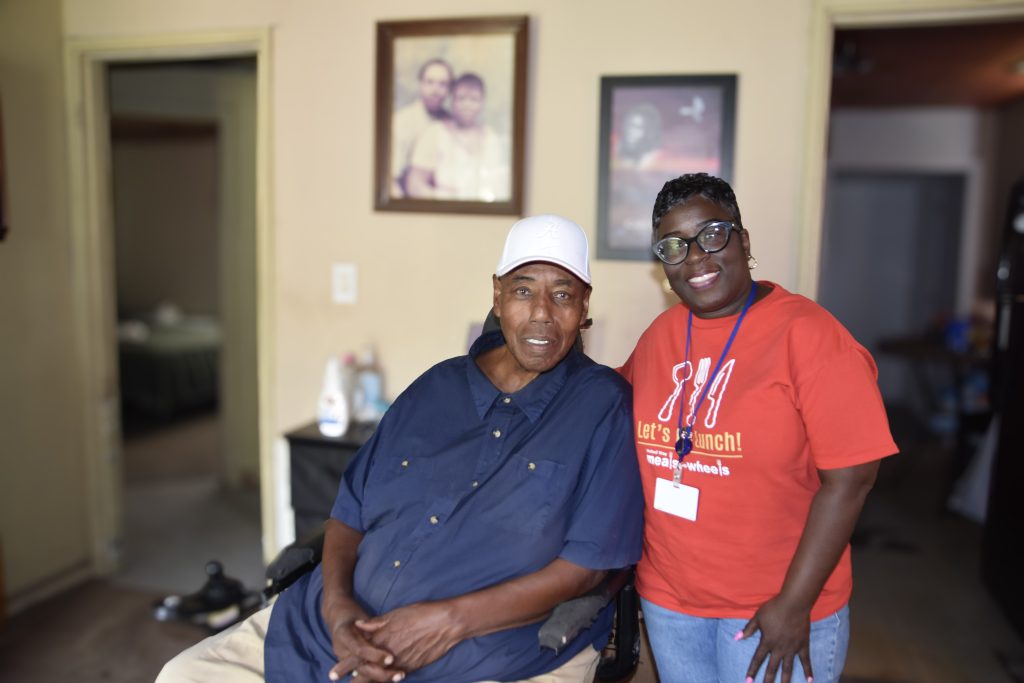 Cleo Jones, a Meals on Wheels client, smiles with April Bell.