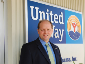 Drew Langloh standing in front of United Way sign