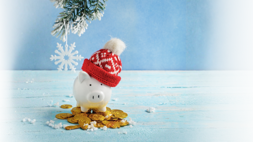 A white piggy bank wearing a red winter hat sits on a pile of gold coins against a snowy blue holiday background, promoting a holiday budgeting and financial planning workshop.