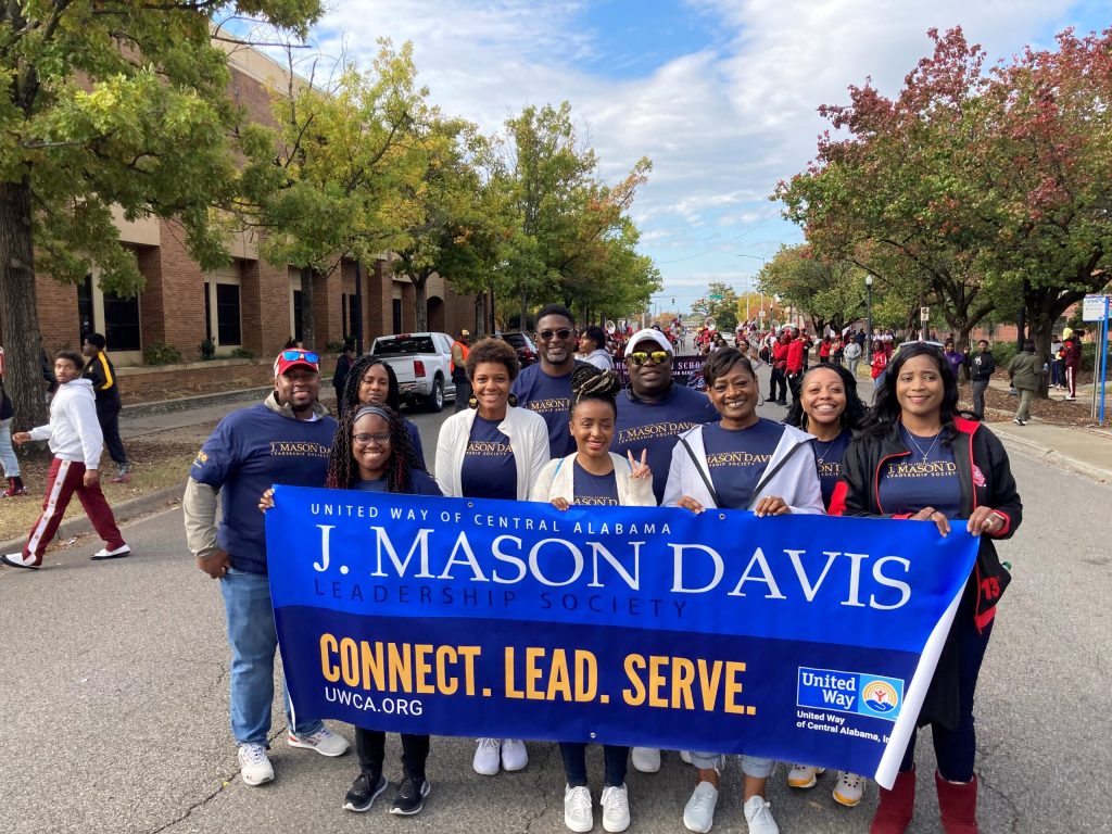 United Way of Central Alabama's J. Mason Davis Leadership Society members proudly represent their commitment to community service and leadership while marching in the Magic City Classic Parade.