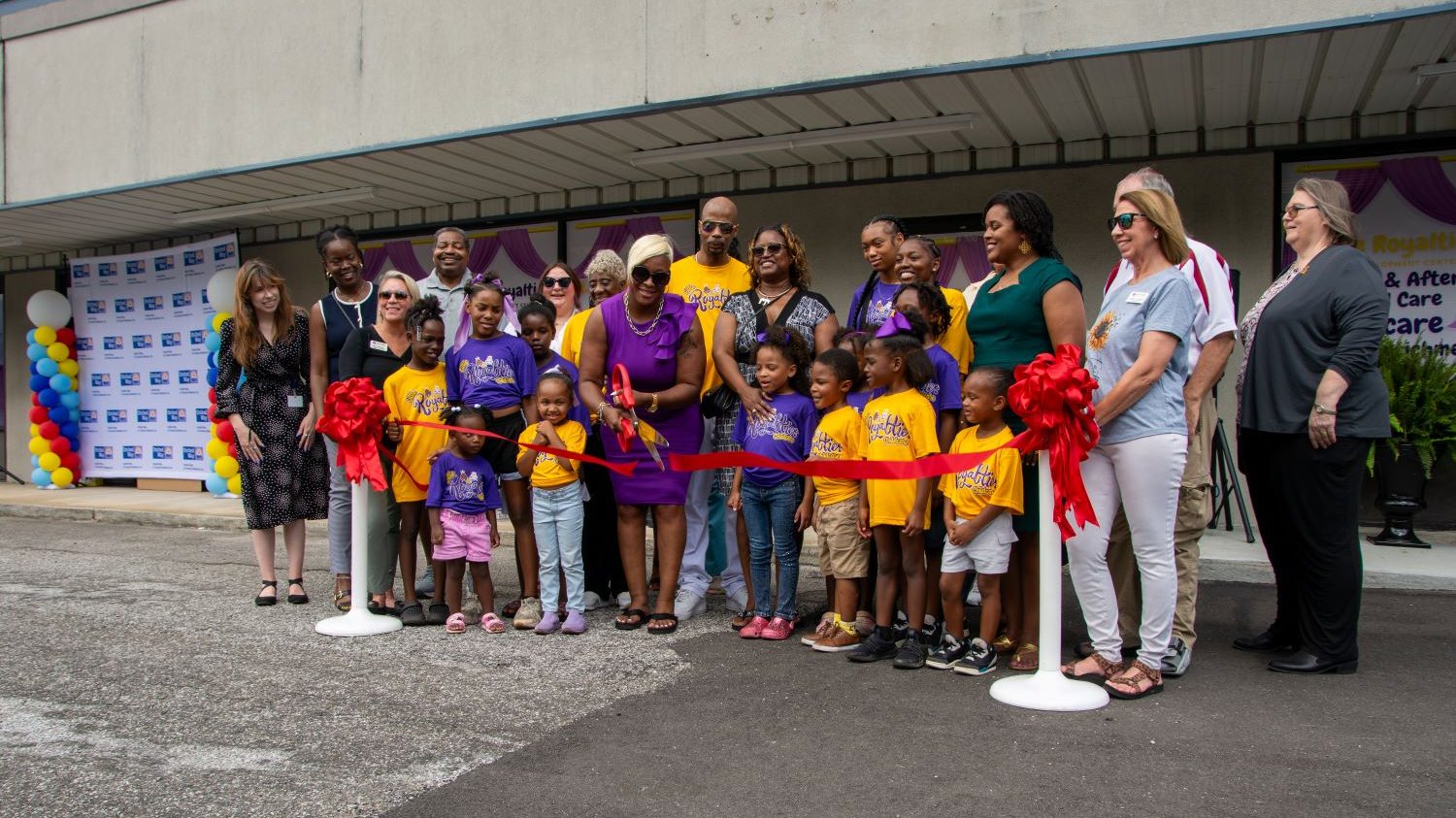 The Little Royalties family with representatives from the Hueytown Chamber of Commerce, United Way of Central Alabama and the Women’s Foundation of Alabama for a celebratory ribbon cutting.